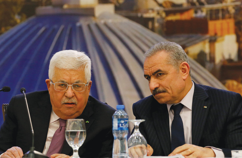  PALESTINIAN AUTHORITY president Mahmoud Abbas attends a meeting with PA Prime Minister Mohammad Shtayyeh (credit: RANEEN SAWAFTA/REUTERS)