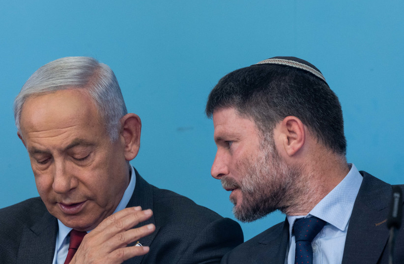 Prime Minister Benjamin Netanyahu and Finance Minister Bezalel Smotrich seen during a press conference, at the Prime Minister's Office in Jerusalem. January 25, 2023 (credit: YONATAN SINDEL/FLASH90)