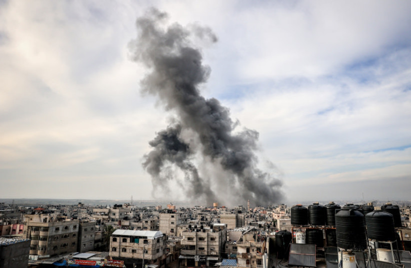  Smoke rises after an Israeli air strike on the city of Rafah in the southern Gaza Strip, on December 20, 2023 (credit: ABED RAHIM KHATIB/FLASH90)