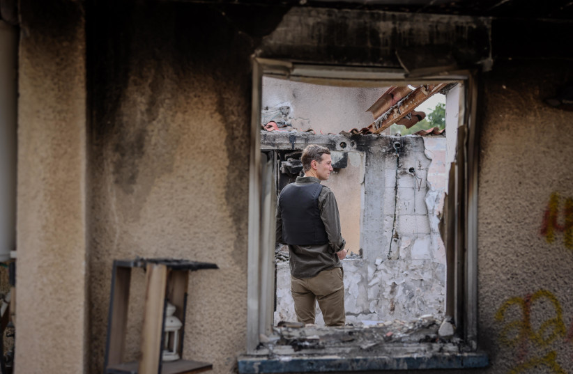  Jared Kushner stands in the wreckage of Kfar Aza. December 21, 2023. (credit: NOAM MOSHKOWITZ/KNESSET SPOKESPERSON)