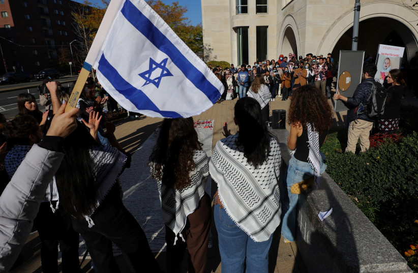  Pro-Israel counter-protesters stand around a demonstration by Harvard Law students participating in the National Day of Action organized by Law Students for a Free Palestine, at Harvard University on November 16, 2023. (credit: BRIAN SNYDER/REUTERS)