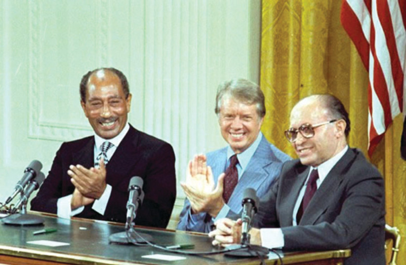  CAMP DAVID, not Oslo: (from L) Egyptian president Anwar Sadat, US president Jimmy Carter, and prime minister Menachem Begin sign the Camp David Accords in the White House, 1978. (credit: Courtesy Jimmy Carter Library/National Archives/Handout via Reuters)
