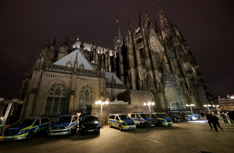  German police secures the cathedral in central Cologne, Germany, December 23, 2023. (credit: THILO SCHMUELGEN/REUTERS)