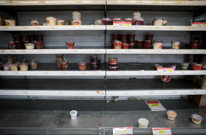  The empty shelves at a supermarket in Talpiot, Jerusalem, after the IDF Home Front Command issued a recommendation to the Israeli public to prepare food/water/necessities for a possible 72 hrs of staying sheltered. October 10, 2023 (credit: NOAM REVKIN FENTON/FLASH90)