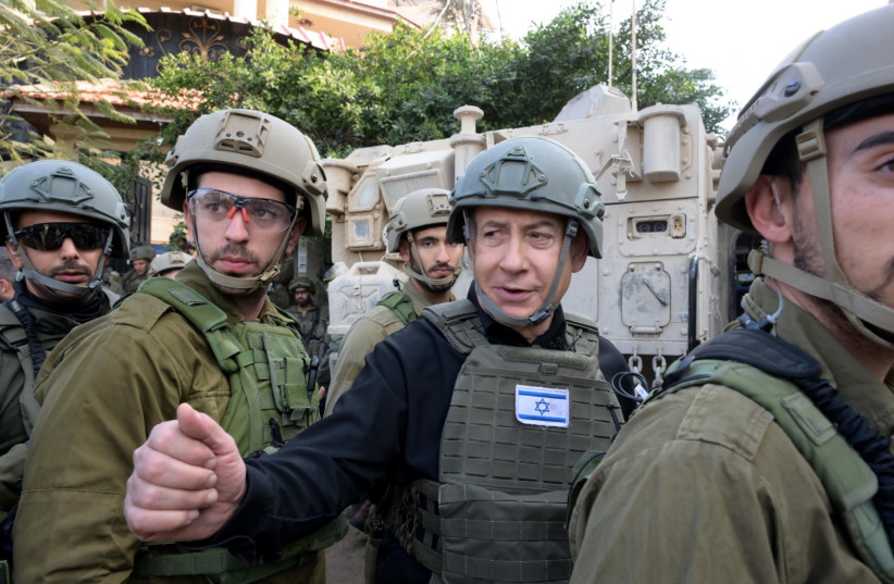 Prime Minister Benjamin Netanyahu meets IDF reservists in the Gaza Strip on December 25, 2023  (credit: IDF SPOKESPERSON'S UNIT)