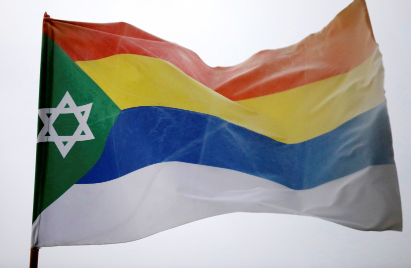  The Druze flag decorated with a Star of David can be seen in the Druze town of Daliat al-Karmel, northern Israel August 2, 2018 (credit: REUTERS/AMIR COHEN)