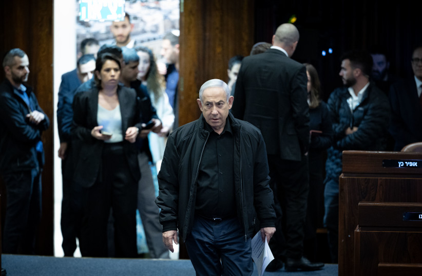  Israeli prime minister Benjamin Netanyahu attends a plenum session for Israelis held kidnapped by Hamas terrorists in Gaza, at the assembly hall of the Knesset, the Israeli parliament in Jerusalem, on December 25, 2023. (credit: YONATAN SINDEL/FLASH90)