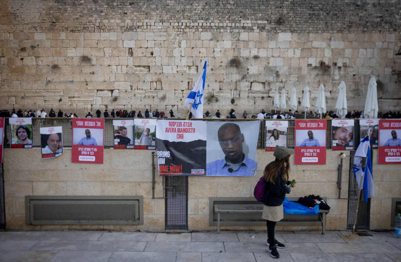  Images of Israelis held hostage by Hamas terrorists in Gaza, seen at the Western Wall, in Jerusalem Old City. December 25, 2023.  (credit: Chaim Goldberg/Flash90)