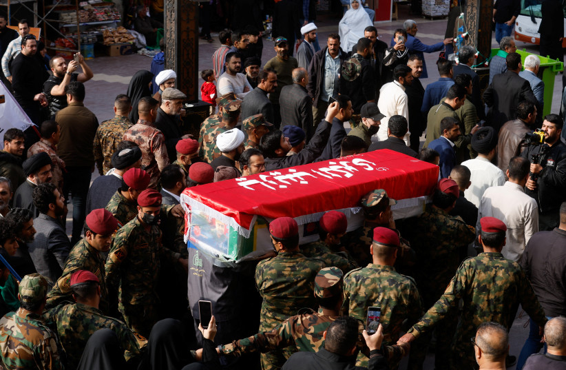  People carry the coffin of senior adviser for Iran's Revolutionary Guards, Sayyed Razi Mousavi, who was killed in an Israeli air strike outside the Syrian capital Damascus, during his funeral in Najaf, Iraq, December 27, 2023 (credit: REUTERS/ALAA AL-MARJANI)