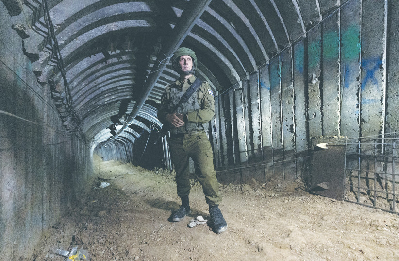  IDF SPOKESMAN Rear Admiral Daniel Hagari stands in a Hamas terror tunnel in the northern Gaza Strip, earlier this month. There must be a process that results in no terror tunnels, no terror leaders, no anti-Israel brainwashing in schools, no terror training, and no weapons, the writer asserts. (credit: AMIR COHEN/REUTERS)