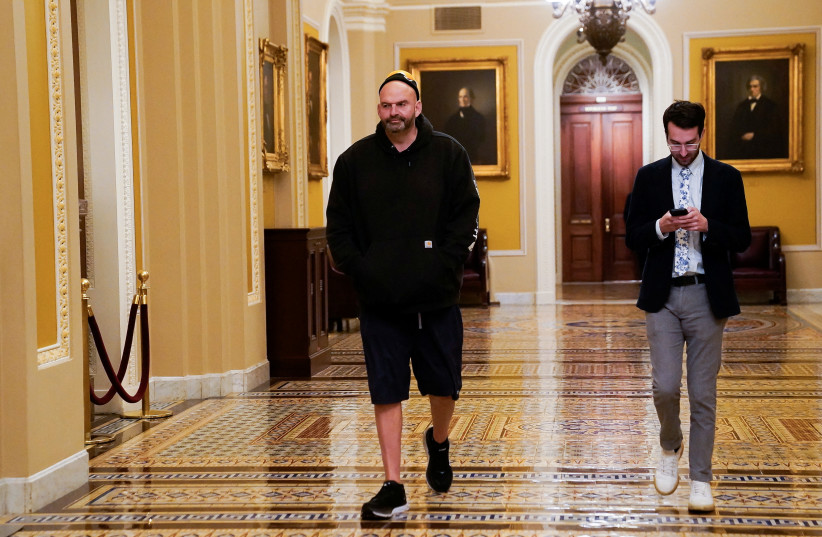  U.S. Senator John Fetterman (D-PA) walks through the U.S. Capitol in Washington, U.S., November 15, 2023. (credit: REUTERS/ELIZABETH FRANTZ)