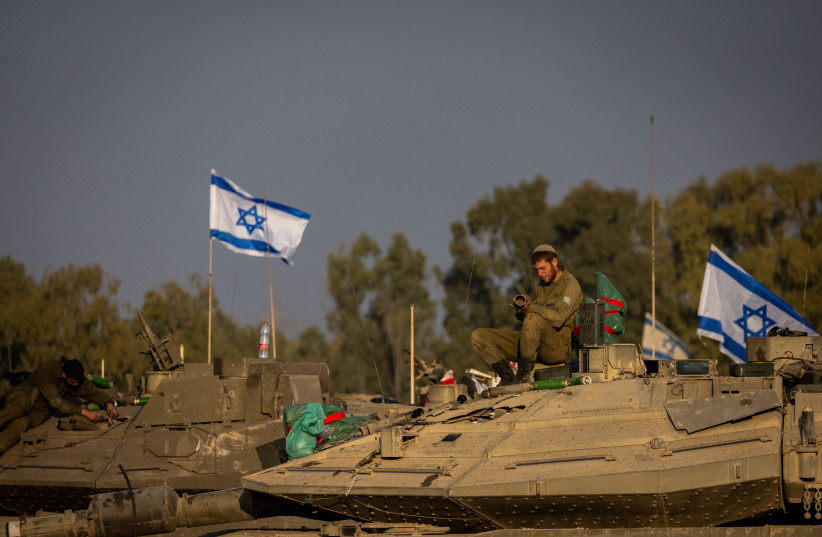  Israeli soldiers seen at a staging area near the Israeli-Gaza border, southern Israel, December 31, 2023 (credit: YONATAN SINDEL/FLASH90)