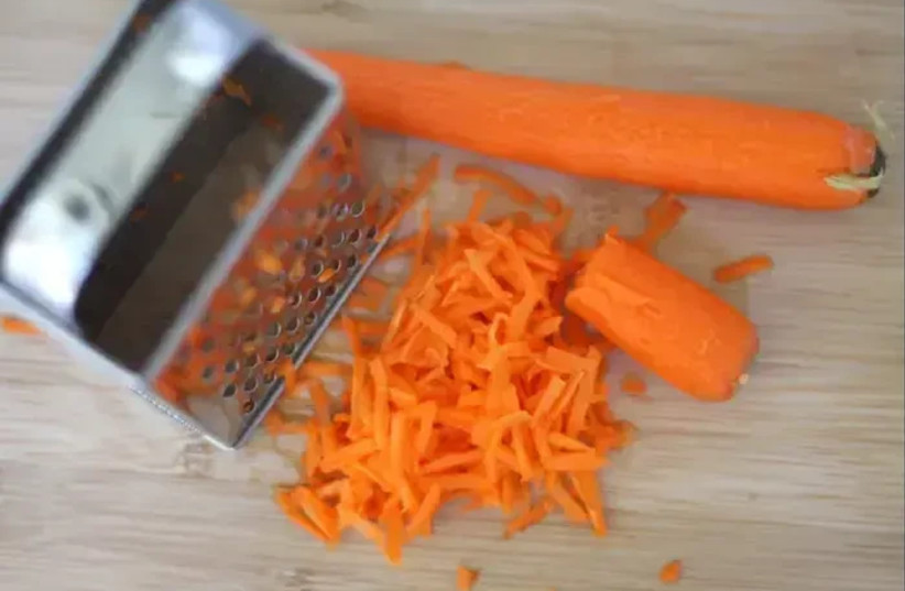  Preparation of carrots with garlic and almonds (credit: Hila Kariv)