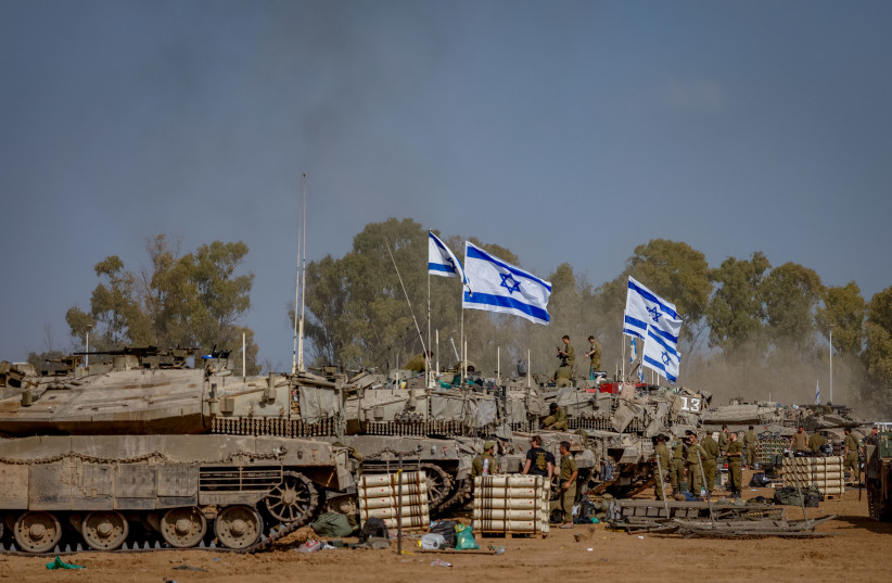  Israeli soldiers seen at a staging area near the Israeli-Gaza border, southern Israel, January 1, 2024. (credit: Chaim Goldberg/Flash90)