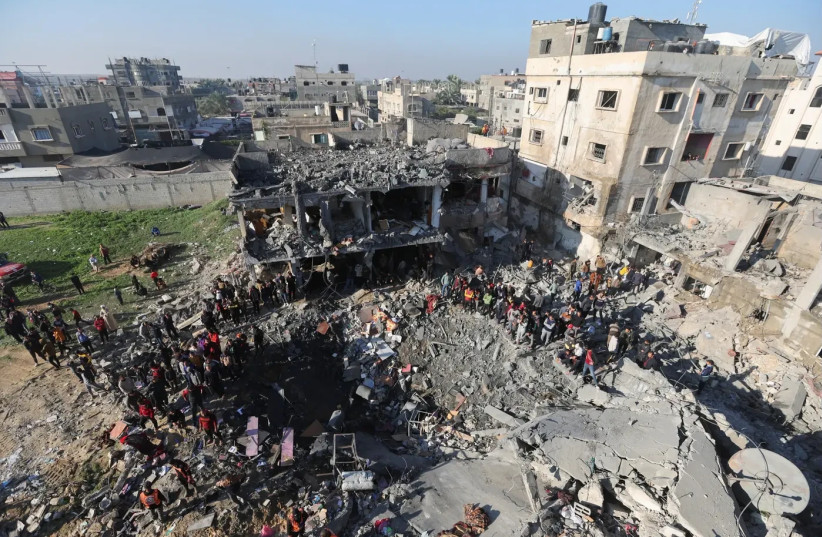  A building destroyed by Air Force strikes in the city of Rafah in the southern Gaza Strip, December 19, 2023 (credit: REUTERS)