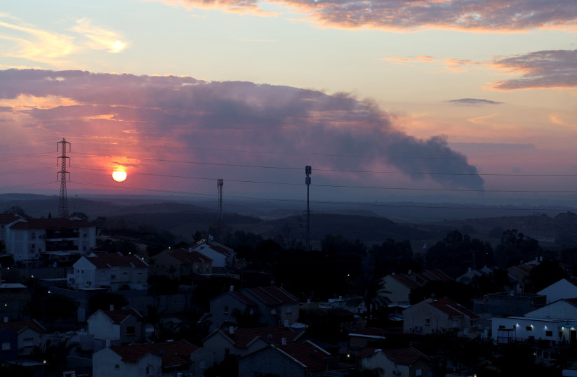  Smoke rises over the Gaza Strip during a sunset, amid the ongoing conflict between Israel and the Palestinian Islamist group Hamas, as seen near Israel's border with Gaza in southern Israel, January 3, 2024.  (credit: Violeta Santos Moura/Reuters)