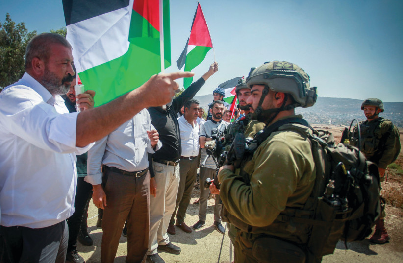  IDF SOLDIERS stand guard while Palestinians and left-wing activists protest near the Jewish settlement of Elon Moreh, east of Nablus, in 2022 (credit: NASSER ISHTAYEH/FLASH90)
