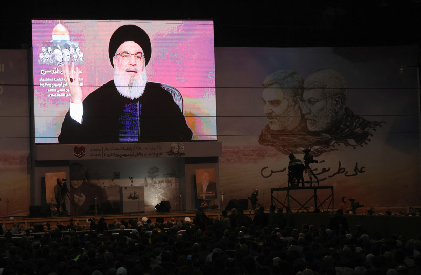  Lebanon's Hezbollah leader Sayyed Hassan Nasrallah addresses his supporters through a screen during a ceremony to mark the fourth anniversary of the killing of senior Iranian military commander General Qassem Soleimani in a U.S. attack, in Beirut's southern suburbs, Lebanon January 3, 2024 (credit: REUTERS/MOHAMED AZAKIR)