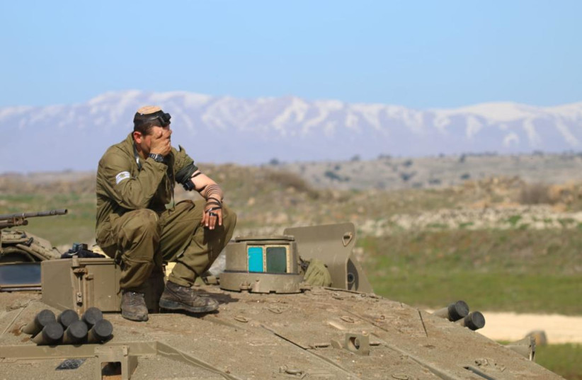  IDF soldier prays with tefillin. (credit: TZALASH)
