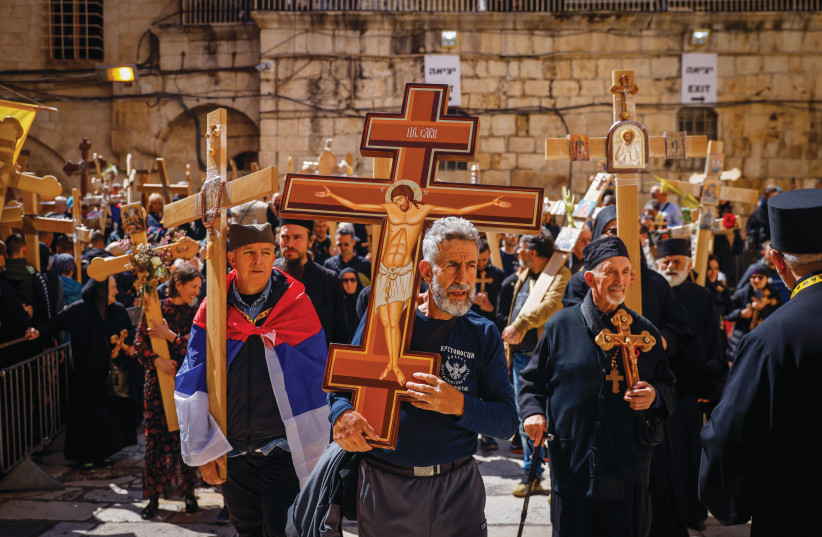  A Good Friday procession is seen in the Old City of Jerusalem in April 2023. (credit: ERIK MARMOR/FLASH90)