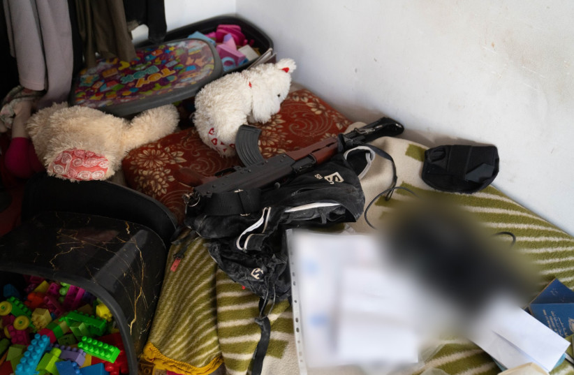  The IDF located weapons in a bedroom along with dolls and games teaching incitement, the IDF said. January 6, 2024. (credit: IDF)