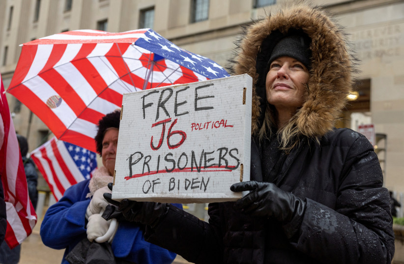  Activists from the group Look Ahead America (LAA) attend a protest in support of people charged with crimes related to the January 6, 2021 attack on the US Capitol, outside the Department of Justice in Washington, US, January 6, 2024. (credit: REUTERS/AMANDA ANDRADE-RHOADES)