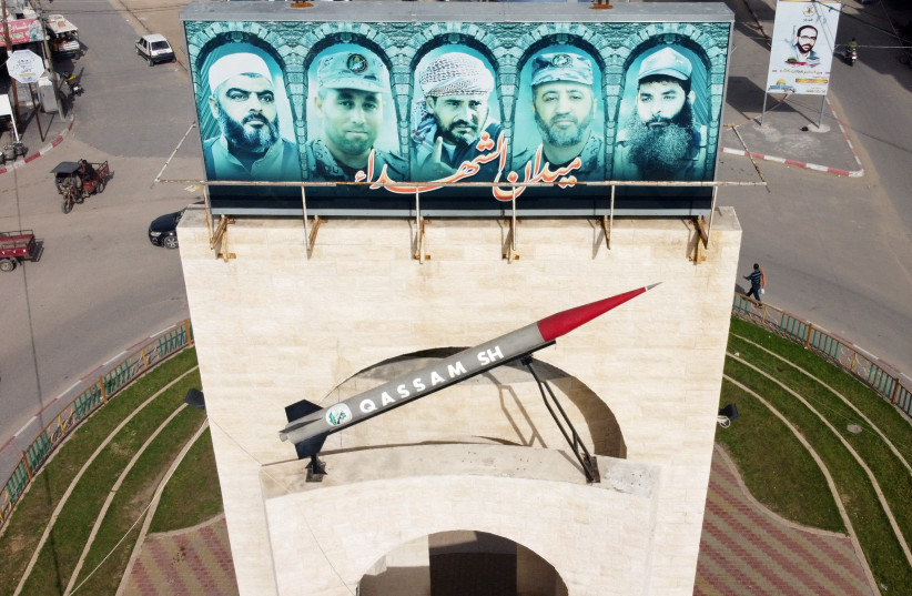  A picture taken with a drone shows a monument of a Hamas rocket with pictures of late commanders from armed Palestinian factions, in Rafah in the southern Gaza Strip February 2, 2021 (credit: REUTERS/MOHAMMED SALEM)