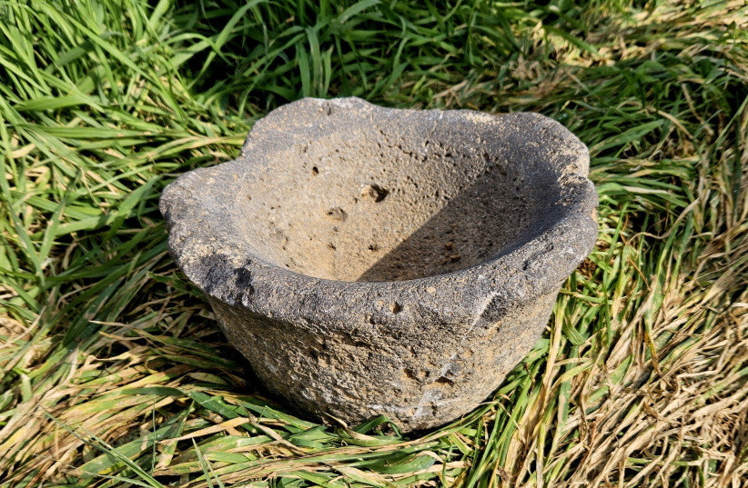   The ancient mortar used for grinding grain. (credit: Sarah Tal Israel Antiquities Authority)