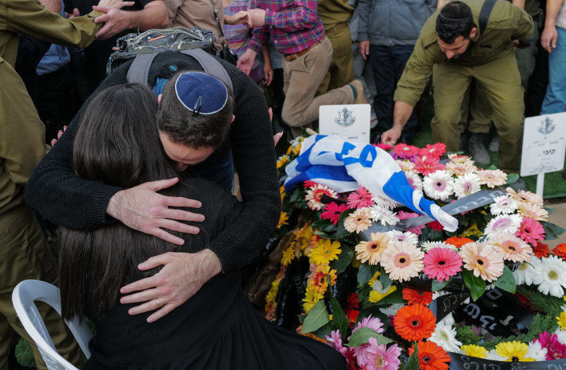  Family members and friends of late Israeli soldier  Sgt. Maj. (res.) Eliraz Gabai who was killed in a military operation in the Gaza Strip attend his funeral in Tiberias, December 31, 2023.  (credit: MICHAEL GILADI/FLASH90)