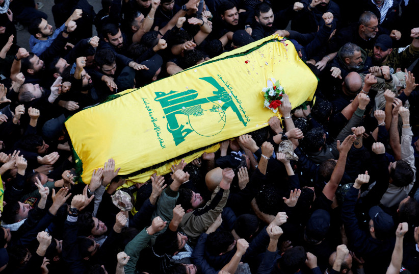  eople carry the coffin of Hezbollah member Abbas Raad, senior Hezbollah figure, November 23, 2023 (credit: REUTERS/ ALAA AL-MARJANI)