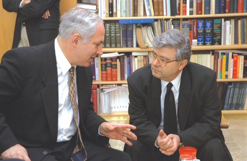  PRIME MINISTER Benjamin Netanyahu confers with then-Supreme Court president Aharon Barak at the latter’s office in the Supreme Court Building in Jerusalem, in 1997. (credit: GPO)