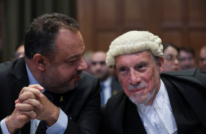  British jurist Malcom Shaw and legal adviser to Israel's Foreign Ministry Tal Becker look on as judges at the International Court of Justice (ICJ) hear a request for emergency measures by South Africa. The Hague, Netherlands, January 11, 2024. (credit: REUTERS/THILO SCHMUELGEN)
