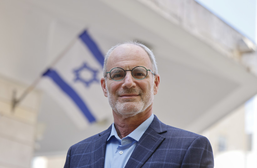  Yechiel Leiter, standing in front of an Israeli flag (credit: MARC ISRAEL SELLEM)