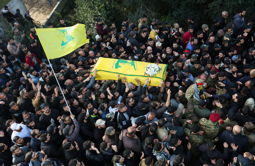  Mourners carry a coffin during the funeral of Wissam Tawil, a commander of Hezbollah’s elite Radwan forces who according to Lebanese security sources was killed during an Israeli strike on south Lebanon, in Khirbet Silem, Lebanon, January 9, 2024. (credit: REUTERS/Aziz Taher REFILE)