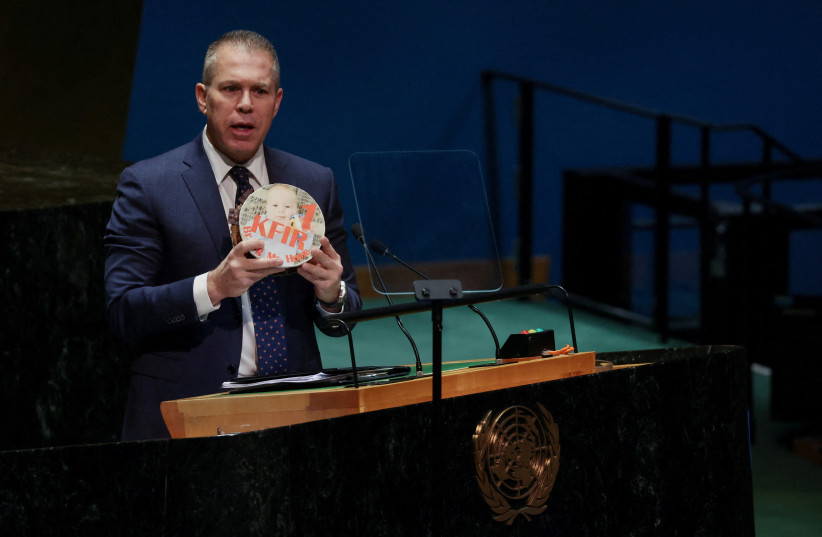  Israeli ambassador to the U.N. Gilad Erdan holds the picture of a child, who he says was kidnapped in the October 7 attack by Hamas, on a birthday cake during a plenary meeting on the 'Use of the veto - Item 63: Special report of the Security Council', in the General Assembly Hall at UN headquarter (credit: REUTERS/SHANNON STAPLETON)