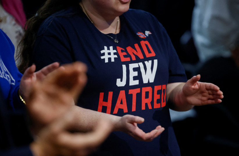  An attendee applauds during a pro-Israel rally at the Soloway Jewish Community Centre in Ottawa, Ontario, Canada October 9, 2023. (credit: REUTERS/BLAIR GABLE)