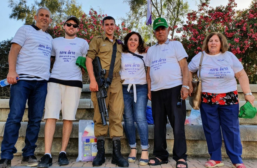  Harel with his parents, brother, and grandparents at the end of his special forces training. The family all wear T-shirts which say “We are proud of you for finishing special forces training.” (Credit: Family Ittah) (credit: Courtesy)
