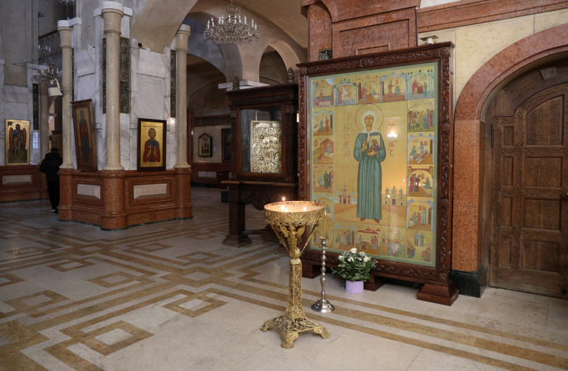  A view shows an icon, an element of which depicts Soviet leader Joseph Stalin being blessed by Russian Orthodox saint Matrona of Moscow, and that was recently defaced with paint in an act of protest amid controversy over the icon’s apparent honouring of Stalin in Tbilisi, Georgia, January 10, 2024. (credit: REUTERS/IRAKLI GEDENIDZE)