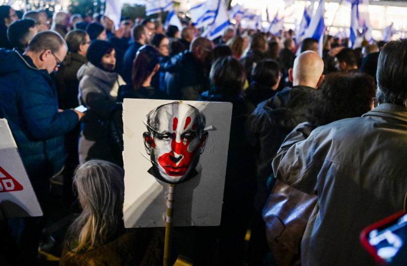  Israelis protest against Prime Minister Benjamin Netanyahu and the current Israeli government, in Tel Aviv, January 13, 2024 (credit: AVSHALOM SASSONI/FLASH90)