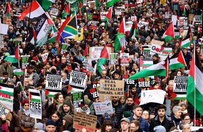 People take part in a protest to mark 100 days since the start of the ongoing conflict between Israel and the Palestinian Islamist group Hamas in Gaza during a march in London, Britain, January 13, 2024. (credit: REUTERS/KEVIN COOMBS)