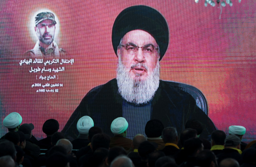  Lebanon's Hezbollah leader Sayyed Hassan Nasrallah gives a televised address at a memorial ceremony to mark one week since the killing of Wissam Tawil, a commander of Hezbollah's elite Radwan forces, in Khirbet Silem, southern Lebanon, January 14, 2024 (credit: REUTERS/AZIZ TAHER)