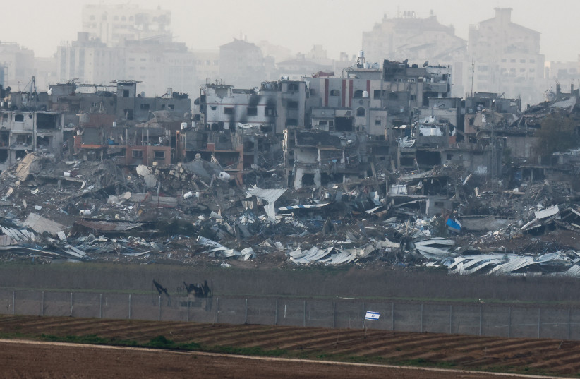  Buildings lie in ruin in Gaza, amid the ongoing conflict between Israel and Hamas, as seen from Israel, January 14, 2024 (credit: REUTERS/AMIR COHEN)
