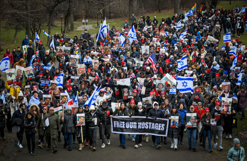  People protest march for hostages marking 100 days since the start of the war between Israel and Hamas, at Central Park in New York City, on January 14, 2024.  (credit: Arie Leib Abrams/Flash90)