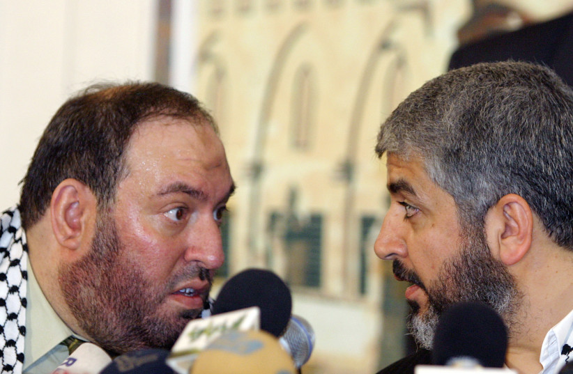  Mohammad Nazzal and Khaled Meshaal at a news conference in Damascus in this January 28, 2006. (credit: REUTERS/Khaled Al-Hariri/Files)