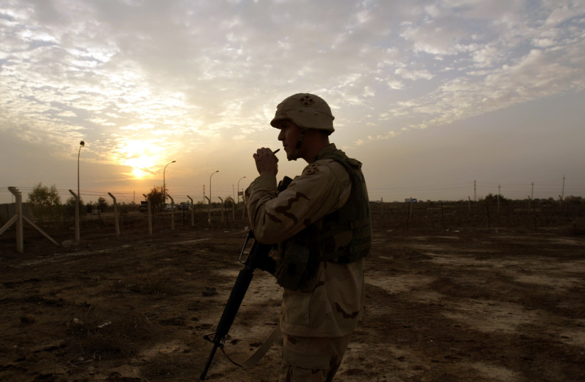 US soldier guarding US army base in Iraq.   (credit: REUTERS/ZOHRA BENSEMRA)