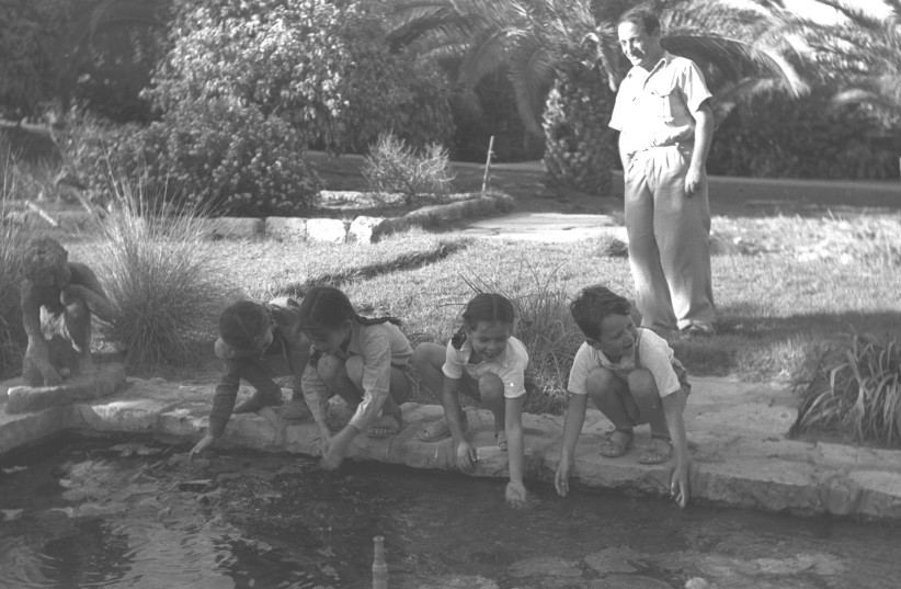 Children playing at a pond in Mishmar Ha’emek in 1948. (credit: GPO)