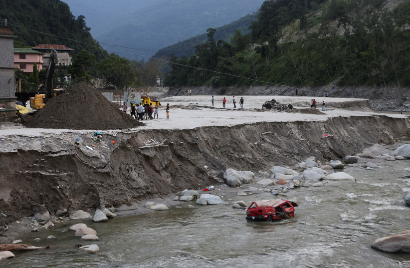  A view of damaged vehicles after flash floods, caused by a lake burst in Singtam, Sikkim, India, October 8, 2023. (credit: REUTERS/FRANCIS MASCARENHAS)