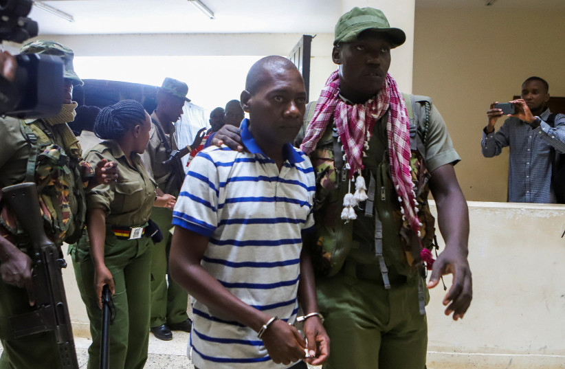  Paul Mackenzie, a Kenyan cult leader accused of ordering his followers, who were members of the Good News International Church, to starve themselves to death in Shakahola forest, is escorted to the Malindi Law Courts in Malindi, Kilifi, Kenya January 17, 2024. (credit: REUTERS/STRINGER)