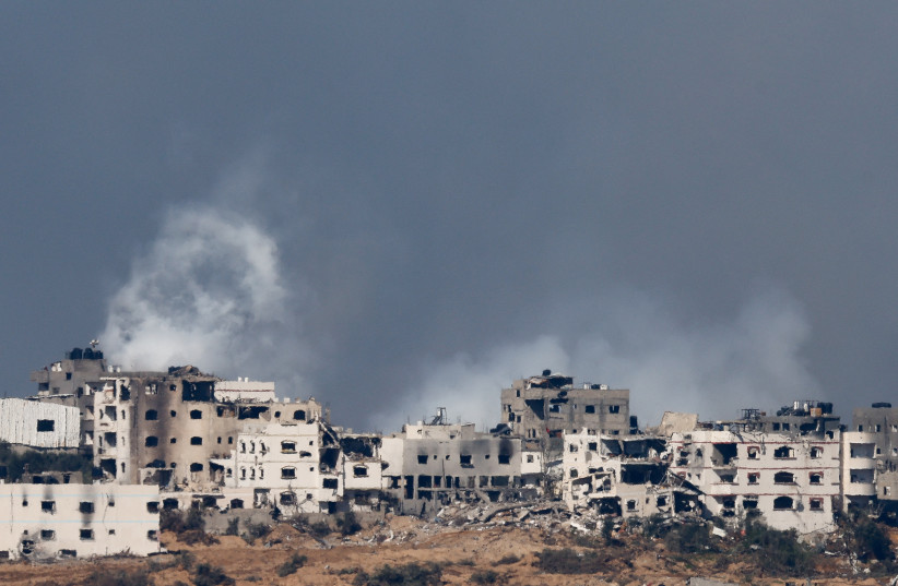  Smoke rises over Gaza, as seen from Israel, January 18, 2024 (credit: REUTERS/TYRONE SIU)