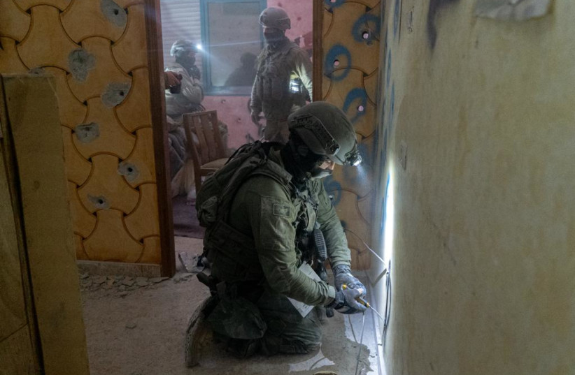   IDF troops demolish the Hebron homes of two terrorists who carried out a terror attack in November. January 21, 2024. (credit: IDF SPOKESPERSON'S UNIT)